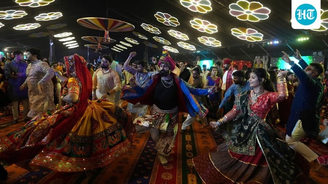 People wearing traditional attire perform Garba, a traditional dance of Gujarat state, on the first night of Navratri, or nine night festival, in Ahmedabad, India, Monday, Sept. 22, 2025. 