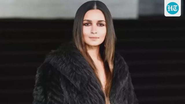 Alia Bhatt attends Gucci's Milan Fashion Week premiere in a dramatic black look. 