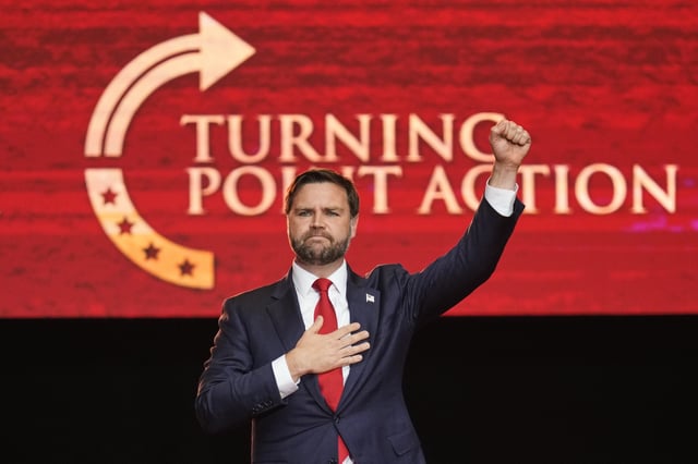 Vice President JD Vance holds his fist up as he leaves the stage after speaking at a memorial for conservative activist Charlie Kirk, Sunday, Sept. 21, 2025, at State Farm Stadium in Glendale, Ariz. (AP Photo/John Locher)