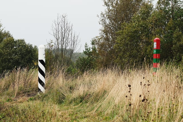Posts mark the border between Estonia, left, and Russia, right, near Vinski, Estonia, Monday, Sept. 15, 2025. (AP Photo/Hendrik Osula)