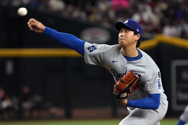 Dodgers starting pitcher Shohei Ohtani throws to the plate during the first inning of their game against the Arizona Diamondbacks on Tuesday night in Phoenix. Ohtani struck out eight in six scoreless innings, but the Dodgers lost, 5-4. (AP Photo/Rick Scuteri)