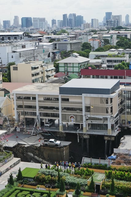 Damage is seen after a road collapse near Vajira Hospital in Bangkok Thailand, Wednesday, Sept. 24, 2025. (AP Photo/Sakchai Lalit)