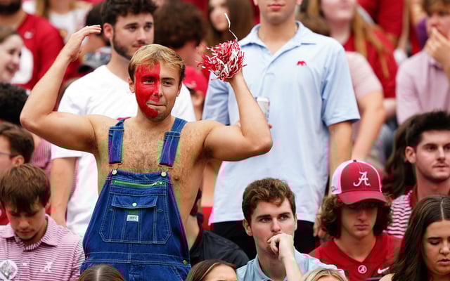Sep 28, 2024; Tuscaloosa, Alabama, USA; An Alabama fan cheers from the stands before the start of the Alabama Crimson Tide game against the Georgia Bulldogs at Bryant-Denny Stadium. Mandatory Credit: John David Mercer-Imagn Images