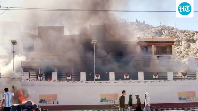Smoke billows out from the Bhartiya Janta Party (BJP) Office as it set on fire during a massive protest over the statehood demand and the inclusion of Ladakh under the Sixth Schedule, in Leh.
