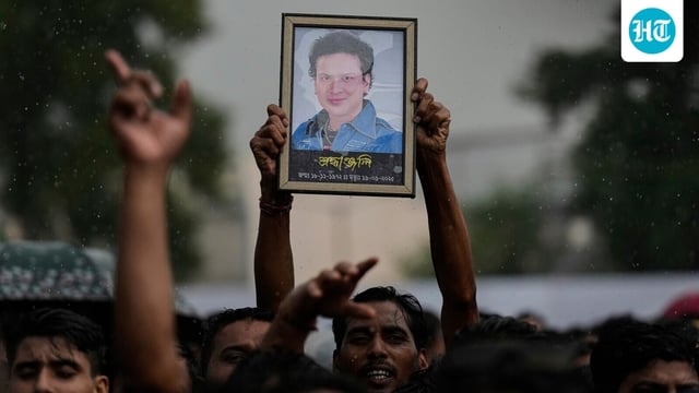 A fan holds a photograph of the popular Bollywood singer and composer Zubeen Garg during the homage ceremony in Guwahati.
