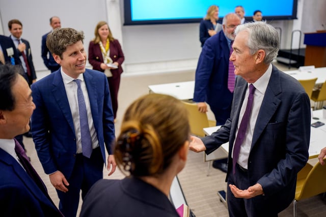 Federal Reserve Chairman Jerome Powell (R) greets OpenAI CEO Sam Altman (L) after he speaks at the Integrated Review of the Capital Framework for Large Banks Conference at the Federal Reserve on July 22, 2025 in Washington, DC.