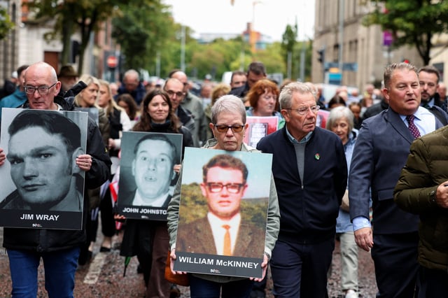 Families of the victims of the 1972 'Bloody Sunday' killings walk to the high court on the first day of the trial of the British army veteran known as 'Soldier F' charged with two murders and five attempted murders in relation to Bloody Sunday, in Belfast, Northern Ireland, September 15, 2025. REUTERS/Cathal McNaughton/ File Photo