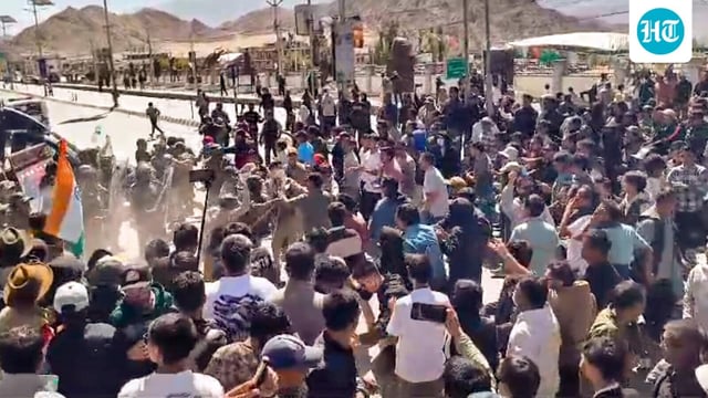 Security personnel try to stop agitators amid a protest and shutdown in Leh, Ladakh, on Wednesday, September 24, 2025. The protest was called in support of the demand to advance the proposed talks with the Centre on extension of Sixth Schedule as well as statehood to Ladakh.