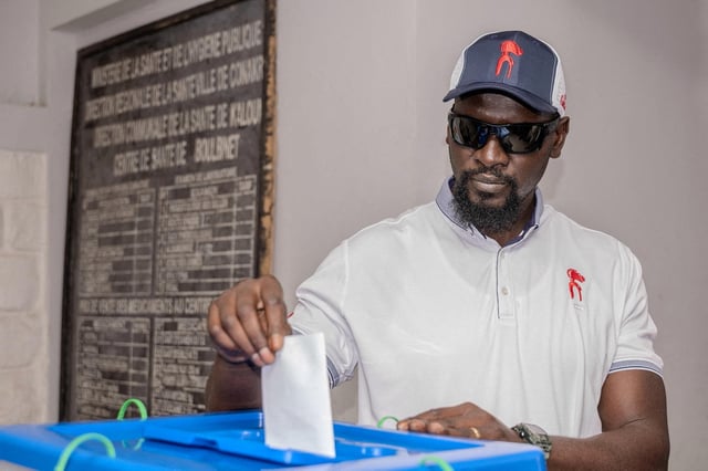 Guinea's military leader Mamady Doumbouya, who seized power in 2021, casts a ballot in a referendum on a new Guinean constitution that could permit him to run for president, in Conakry, Guinea, in this handout photo obtained by Reuters, September 21, 2025.  Presidency of the Republic of Guinea/Handout via REUTERS/ File Photo