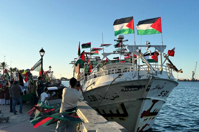 People, holding Palestinian flags, gather at the Port of Tripoli to show their supports as the 'Omar al-Mukhtar' ship, which will join the Global Sumud Flotilla from Libya, prepares to leave in Tripoli, Libya on September 16, 2025.