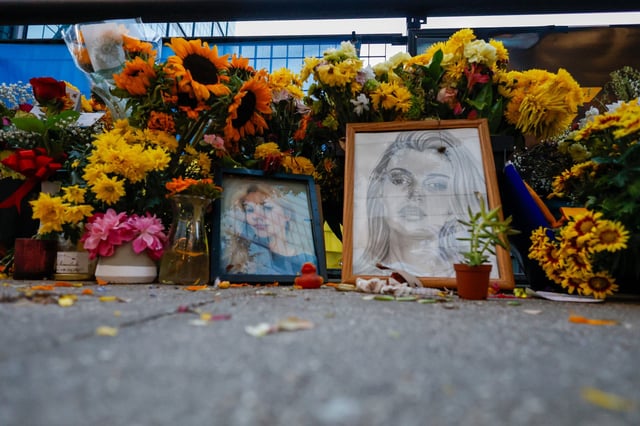 Flowers and photos for Iryna Zarutska, who was fatally stabbed on a commuter train last month, seen in Charlotte, North Carolina, on September 22.