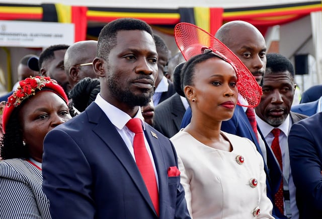 Robert Kyagulanyi, also known as Bobi Wine, of the National Unity Platform (NUP) party, and his wife Barbara Itungo Kyagulanyi, attend a ceremony for his nomination as a presidential candidate at the Electoral Commission offices in Kampala, Uganda September 24, 2025. REUTERS/Abubaker Lubowa
