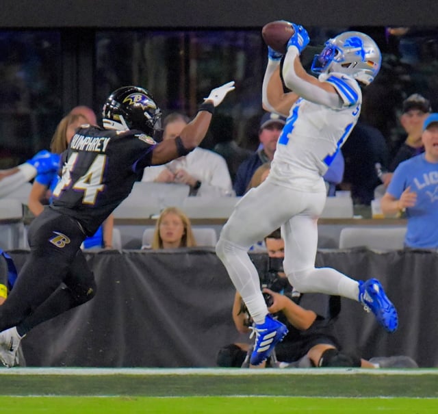 Lions wide receiver Amon-Ra St. Brown hauls in a touchdown catch against the Baltimore Ravens in Baltimore. (Karl Merton Ferron/Staff)