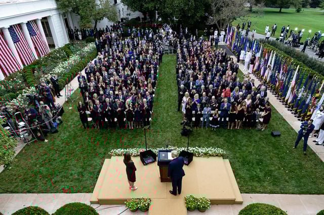 FILE - President Donald Trump, center, stands with Judge Amy Coney Barrett as they arrive for a news conference to announce Barrett as his nominee to the Supreme Court, Sept. 26, 2020 in the Rose Garden at the White House in Washington. Former New Jersey Gov. Chris Christie watches from fourth row from front on far right. (AP Photo/Alex Brandon, File)