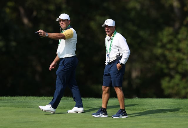 Golf - The 2025 Ryder Cup - Bethpage Black Golf Course, Farmingdale, New York, United States - September 23, 2025 Team Europe vice captain Francesco Molinari and former footballer Gianfranco Zola during a practice round REUTERS/Paul Childs