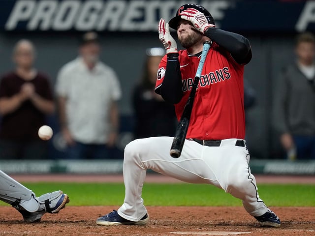 CORRECTION CORRECTS HITTING ON THE FACE BY PITCH - Cleveland Guardians' David Fry falls back after being hit in the face by a pitch in the sixth inning of a baseball game against the Detroit Tigers in Cleveland, Tuesday, Sept. 23, 2025. (AP Photo/Sue Ogrocki)