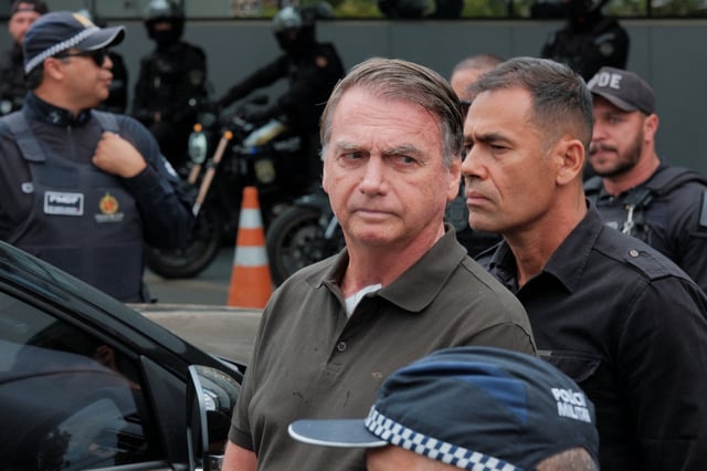 Former Brazilian President Jair Bolsonaro leaves the hospital where he went to undergo a skin surgery procedure, authorized by Supreme Court Justice Alexandre de Moraes, leaving the house arrest after being convicted by a Supreme Court majority of plotting a coup to remain in power after losing the 2022 election, in Brasilia, Brazil, September 14, 2025. REUTERS/Diego Herculano/ File Photo