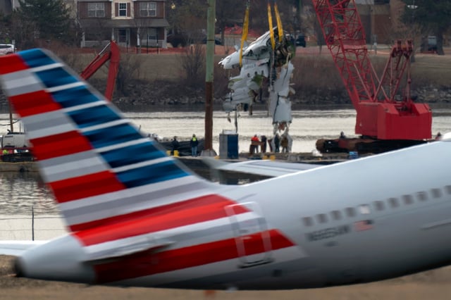 FILE - Crews pull up a part of a plane from the Potomac River near Ronald Reagan Washington National Airport, Monday, Feb. 3, 2025, in Arlington, Va. (AP Photo/Jose Luis Magana, file)
