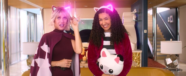 Vera the Cat Lady (Kristen Wiig), left, and Gabby (Laila Lockhart Kraner) in DreamWorks Animation’s “Gabby’s Dollhouse: The Movie.”