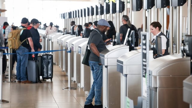 Passengers get checked in at the Winnipeg airport. The number of new Canadian citizens being added to the population has slowed to a crawl, Statistics Canada data shows.