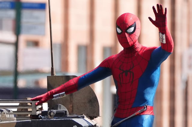 A person in a Spider-Man suit during filming on Hutcheson Street in Glasgow for the latest film in the Spider-Man franchise, Spider-Man: Brand New Day. The sequel will see Tom Holland reprise his main role and is set to be directed by Destin Daniel Cretton. Picture date: Wednesday August 13, 2025. (Photo by Andrew Milligan/PA Images via Getty Images)