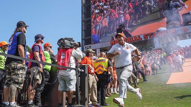 Sep 20, 2025; Clemson, South Carolina, USA; Clemson Tigers head coach Dabo Swinney runs down the hill before in Memorial Stadium before the game against the Syracuse Orange. Mandatory Credit: Ken Ruinard/GREENVILLE NEWS-USA TODAY Network via Imagn Images