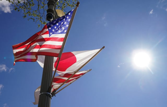 Japanese and U.S. Flags fly side by side in front of the White House in Washington, U.S., April 5, 2024.  REUTERS/Kevin Lamarque/ File Photo