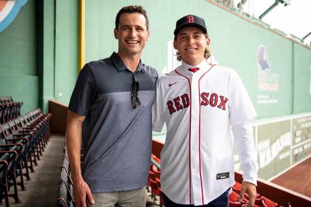 Boston Red Sox first-round draft pick Mikey Romero poses for a photo with Director of Amateur Scouting Paul Toboni after signing a contract with the club on July 25, 2022 at Fenway Park in Boston. (Photo by Maddie Malhotra/Boston Red Sox/Getty Images)