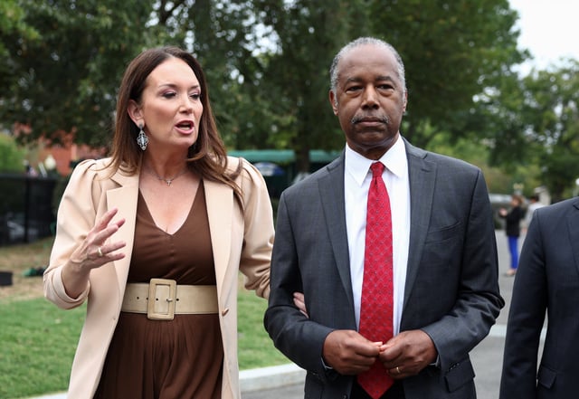 Ben Carson, a former neurosurgeon who served as U.S. Secretary of Housing and Urban Development (HUD) during U.S. President Donald Trump's first term, walks with U.S. Secretary of Agriculture Brooke Rollins after they spoke to reporters at the White House.