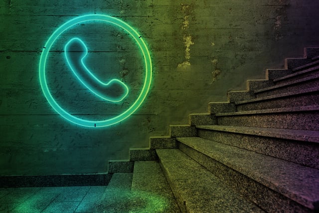 Telephone sign on concrete wall.communication concept
