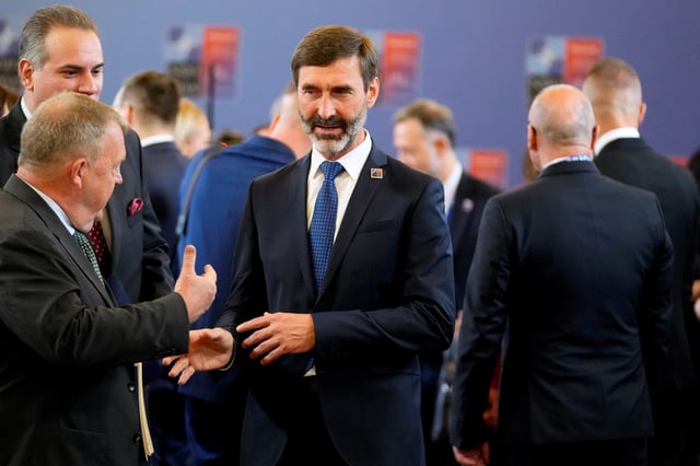 Denmark’s Foreign Minister Lars Lokke Rasmussen speaks with Slovakia’s Foreign Minister Juraj Blanar during a meeting of NATO foreign ministers at the Czernin Palace, in Prague, Czech Republic, May 31, 2024. Peter David Josek/Pool via REUTERS/File Photo