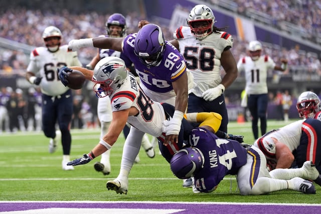 Efton Chism scores a touchdown during a Patriots-Vikings preseason game in August.