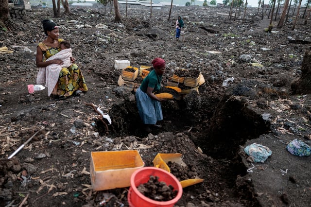 Kahindo, an internally displaced woman, who said they could not return home because it was destroyed during the fighting, gathers volcanic gravel to sell at an IDP's camp which was emptied after the M23 rebels ordered many displaced people to leave the camps in Mugunga district, near Goma, in eastern Democratic Republic of Congo, March 22, 2025. REUTERS/Zohra Bensemra/File Photo