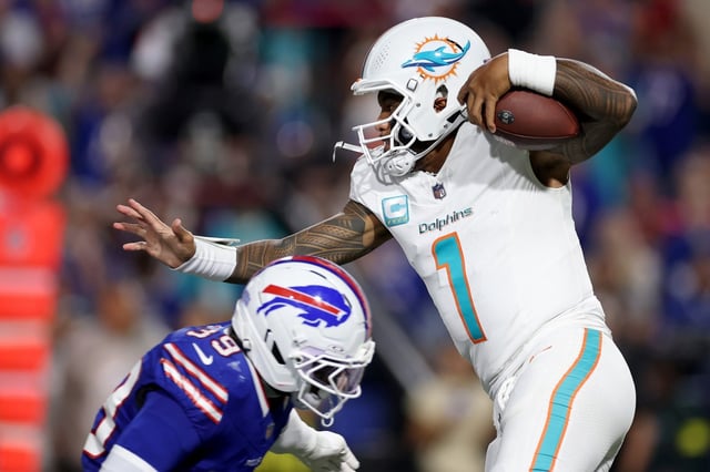 Tua Tagovailoa #1 of the Miami Dolphins runs with the ball in the first half of the game against the Buffalo Bills at Highmark Stadium on Sept. 18, 2025 in Orchard Park, New York. (Photo by Sarah Stier/Getty Images)