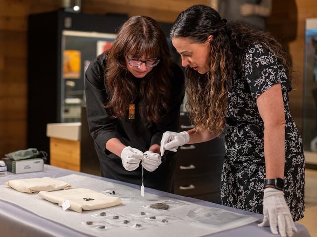 Sabrina Higgins, SFU associate professor of global humanities and archeology, and Barbara Hilden, director, SFU Museum of Archaeology and Ethnology, examine the rare artifacts that have been donated for study. The 11 rings and two medallions, thought to date from ancient Roman times were discord at the Thrifty Boutique in Chilliwack.