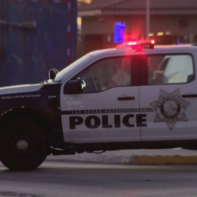 A police vehicle blocks the turn lane leading to the main gate for Nellis Air Force Base in the Las Vegas area after a shooting on Wednesday, Sept. 24, 2025. (KSNV)