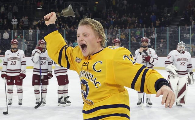 Quinnipac captain Zach Metsa lifts the coveted Belpot Trophy after defeating Massachusetts in the 2022 Friendship Four final at the SSE Arena, Belfast (photo: William Cherry/Presseye).