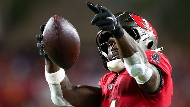 Oct 21, 2024; Tampa, Florida, USA; Tampa Bay Buccaneers wide receiver Chris Godwin (14) celebrates a first down against the Baltimore Ravens in the second quarter at Raymond James Stadium. Mandatory Credit: Nathan Ray Seebeck-Imagn Images