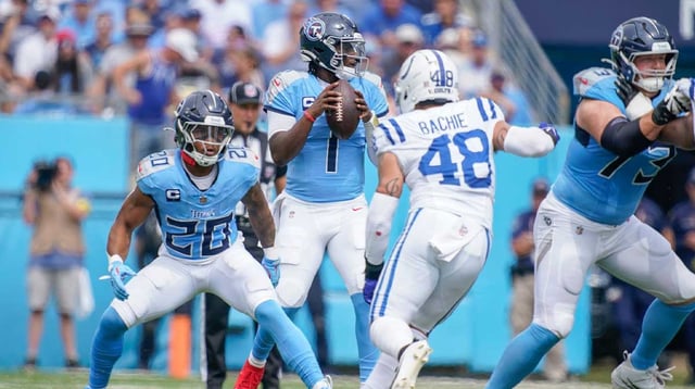 Tennessee Titans quarterback Cam Ward (1) looks for a receiver as Indianapolis Colts linebacker Joe Bachie (48) closes in during the first quarter at Nissan Stadium in Nashville, Tenn., Sunday, Sept. 21, 2025. Mandatory Credit: © Andrew Nelles / The Tennessean / USA TODAY NETWORK via Imagn Images