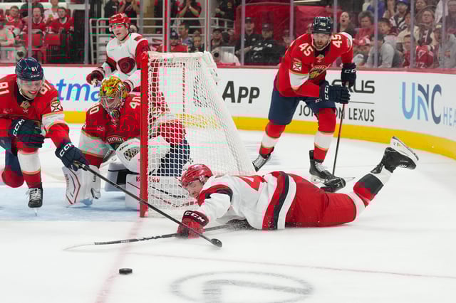 Carolina Hurricanes center Ivan Ryabkin can’t get the puck against Florida Panthers goaltender Daniil Tarasov (James Guillory-Imagn Images)