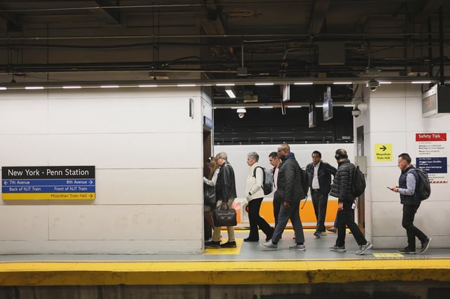 Commuters exit their train at the NJ Transit section of Penn Station on May 20, 2025 in New York City.