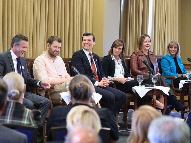 Calgary mayoralty candidates share a laugh during a debate hosted by the Ranchman’s Club on Wednesday, Sept. 24, 2025. From left are; Jeff Davison, Jaeger Gustafson, Jeromy Farkas, Sonya Sharp, Sarah Elder and Jyoti Gondek.
