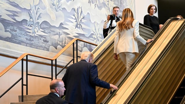 President Trump and first lady Melania Trump walk up an escalator as they arrive to the 80th session of the UN's General Assembly at the United Nations headquarters in New York City on Tuesday. Photo: Alexi J. Rosenfeld/Getty Images
