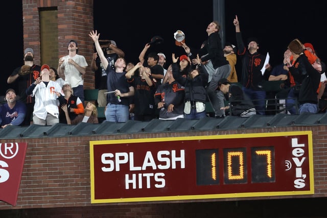San Francisco Giants fans watch Rafael Devers’ home run sail over their heads toward McCovey Cove in the third inning of the Giants' 4-3 win over the Cardinals at Oracle Park on Wednesday.