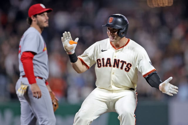Giants catcher Andrew Knizner celebrates his go-ahead RBI triple in eighth inning against the Cardinals at Oracle Park on Wednesday.