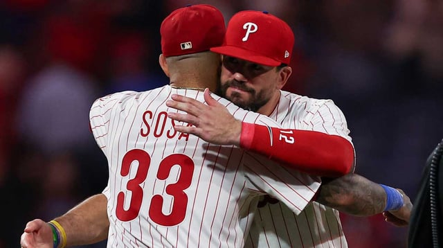 Sep 24, 2025; Philadelphia, Pennsylvania, USA; Philadelphia Phillies short stop Edmundo Sosa (33) and outfielder Kyle Schwarber (12) celebrate a victory against the Miami Marlins at Citizens Bank Park. Mandatory Credit: Bill Streicher-Imagn Images.