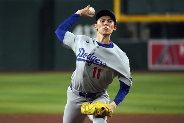 Sep 24, 2025; Phoenix, Arizona, USA; Los Angeles Dodgers pitcher Roki Sasaki throws against the Arizona Diamondbacks in the seventh inning at Chase Field. Mandatory Credit: Rick Scuteri-Imagn Images