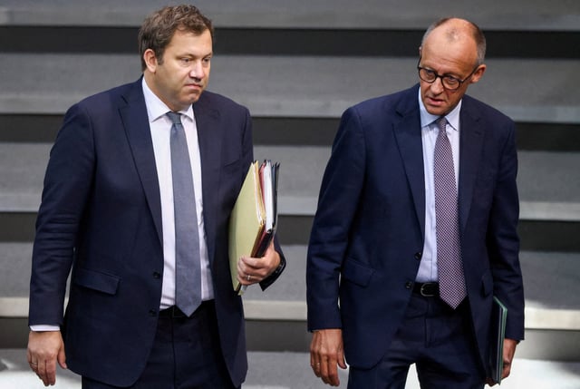 German Chancellor Friedrich Merz and Vice Chancellor and Finance Minister Lars Klingbeil arrive for the annual budget debate at the Bundestag, in Berlin, Germany, September 24, 2025. REUTERS/Liesa Johannssen/File Photo