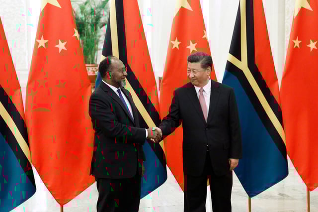 BEIJING, CHINA - MAY 28: Vanuatu Prime Minister Charlot Salwai and Chinese President Xi Jinping shake hands at the Great Hall of the People on May 28, 2019 in Beijing, China.  (Photo by Florence Lo - Pool/Getty Images)