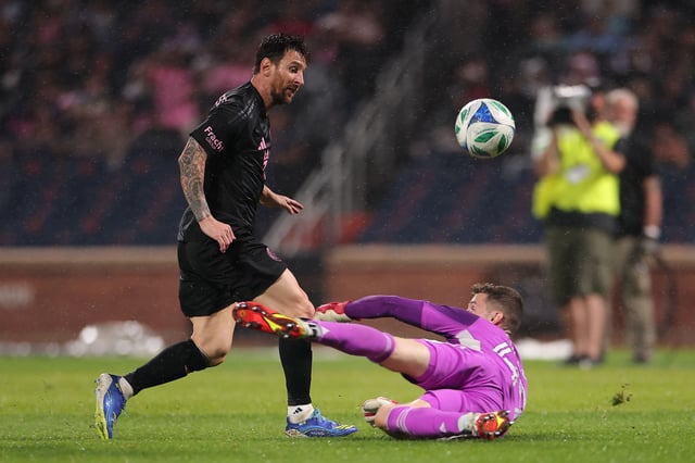 Messi chips the ball over the goalkeeper to score his first goal against New York City FC.